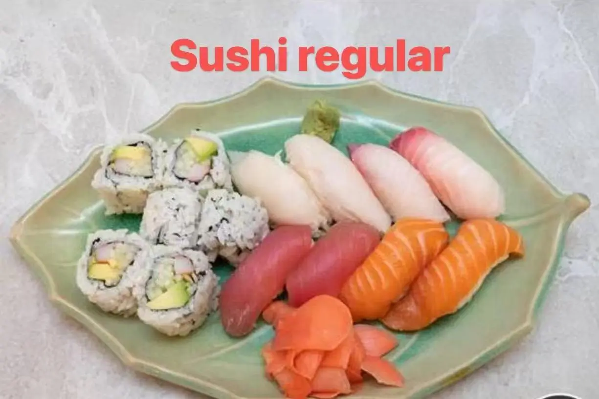 Regular sushi platter featuring assorted nigiri and maki rolls, served with wasabi and pickled ginger at FUJI SAN Japanese restaurant in Vestal
