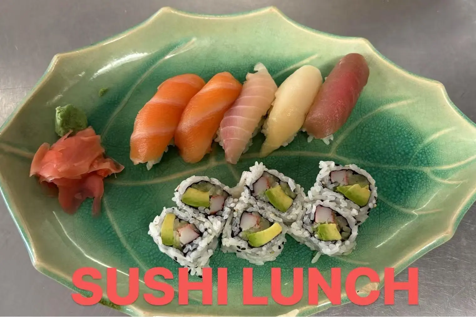 Sushi lunch set with salmon, tuna, and avocado maki rolls, served with wasabi and pickled ginger at FUJI SAN Japanese restaurant in Vestal