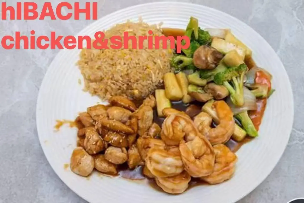Hibachi - style dish with chicken, shrimp, fried rice, and mixed vegetables at FUJI SAN Japanese restaurant in Vestal