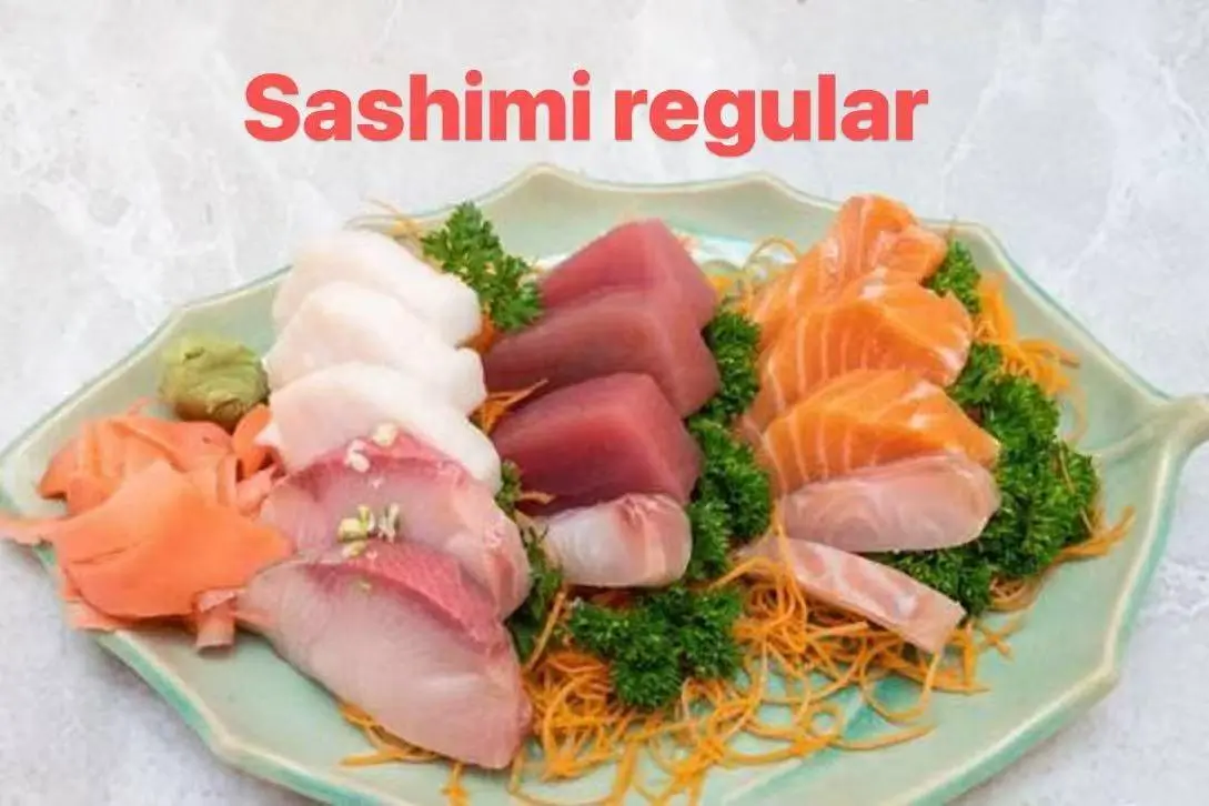 Regular sashimi platter with assorted fresh raw fish, served with wasabi and pickled ginger at FUJI SAN Japanese restaurant in Vestal