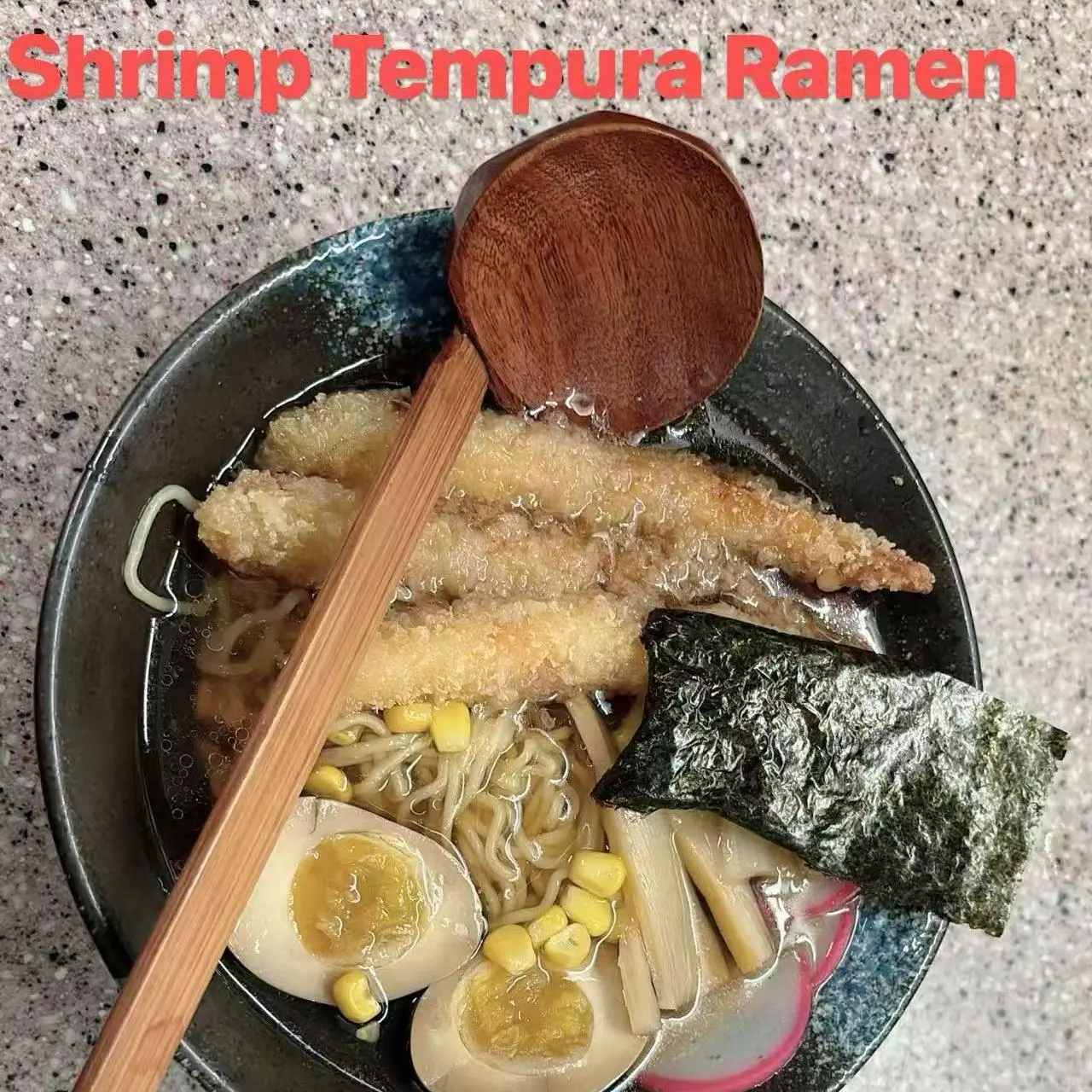 Ramen with shrimp tempura, noodles, seaweed, soft - boiled eggs, corn, and pickled radish at FUJI SAN Japanese restaurant in Vestal